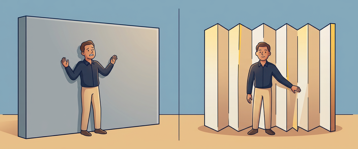 A man behind a solid gray wall with raised hands on the right a man stands free inside a jagged light colored barrier